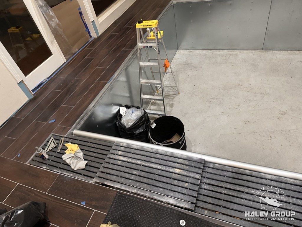 Steel pool panels set, with new plank tile and grate deck sections around the edge